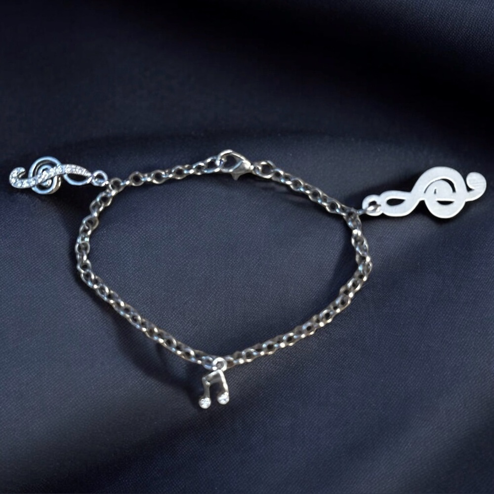 Silver tone musical notes charm bracelet